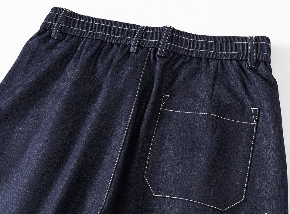 Relaxed Pleated Trousers in Deep Indigo